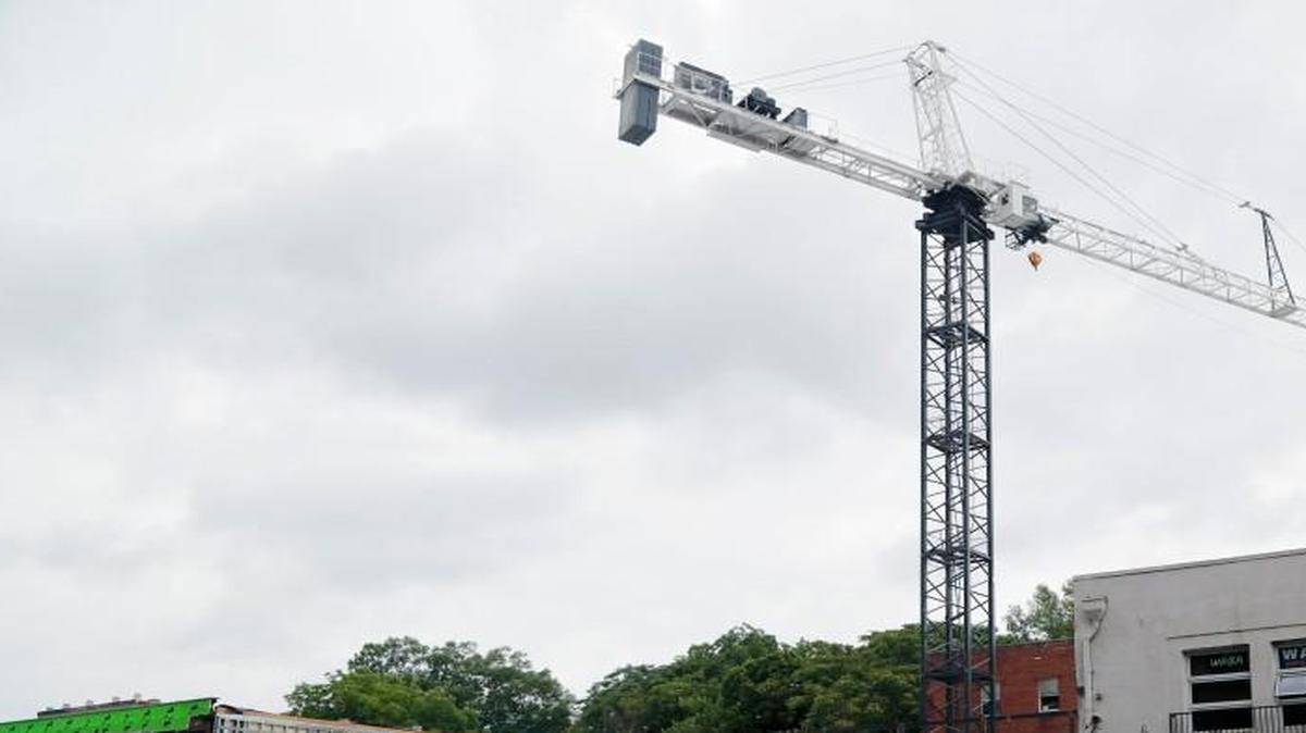 A crane sits atop the stalled construction site at 2504 Hillsborough St., across from N.C. State University in Raleigh in June.