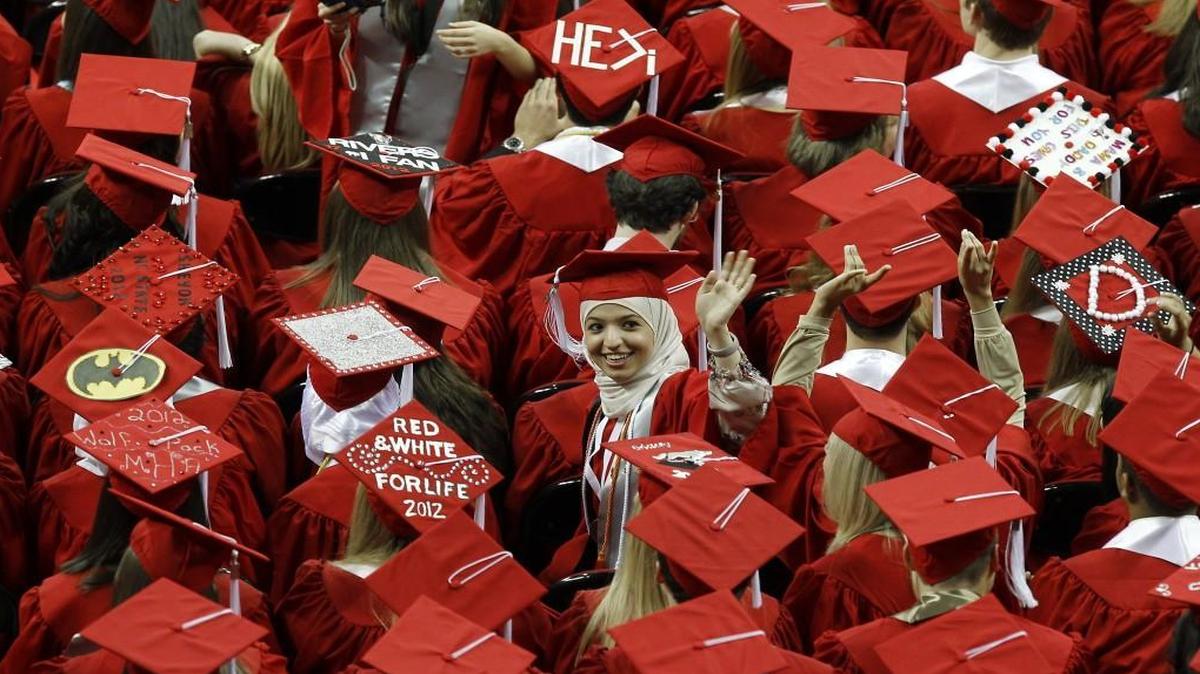 Some graduates say they’d commit to an employer for five years if the company helped pay off their student loan. Now companies are beginning to offer that perk.