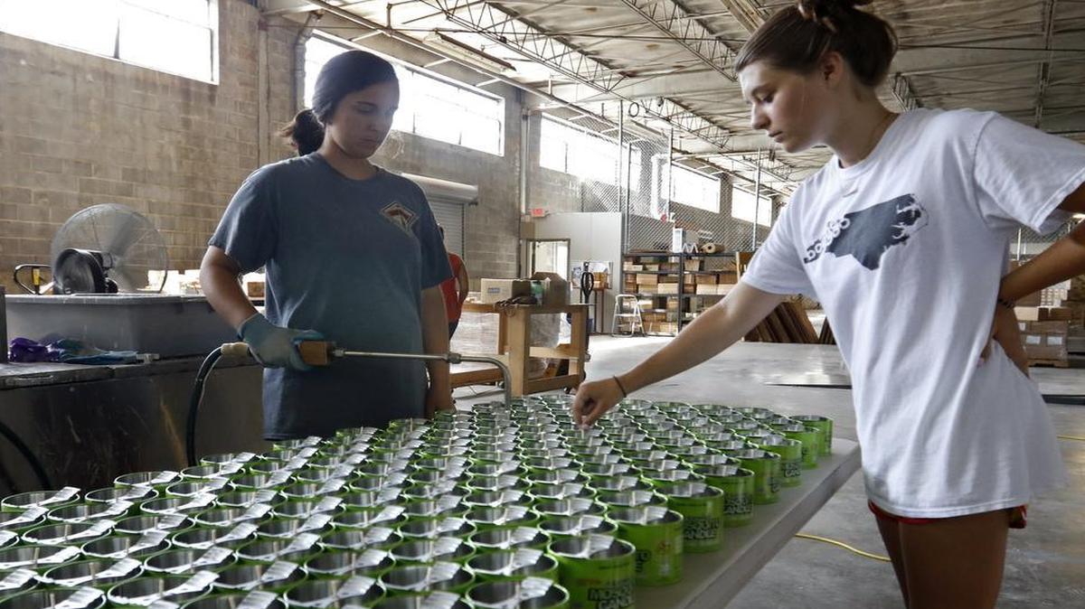Murphy’s Naturals employees fill insect repellent candles at the Loading Dock co-working space in Raleigh in 2016