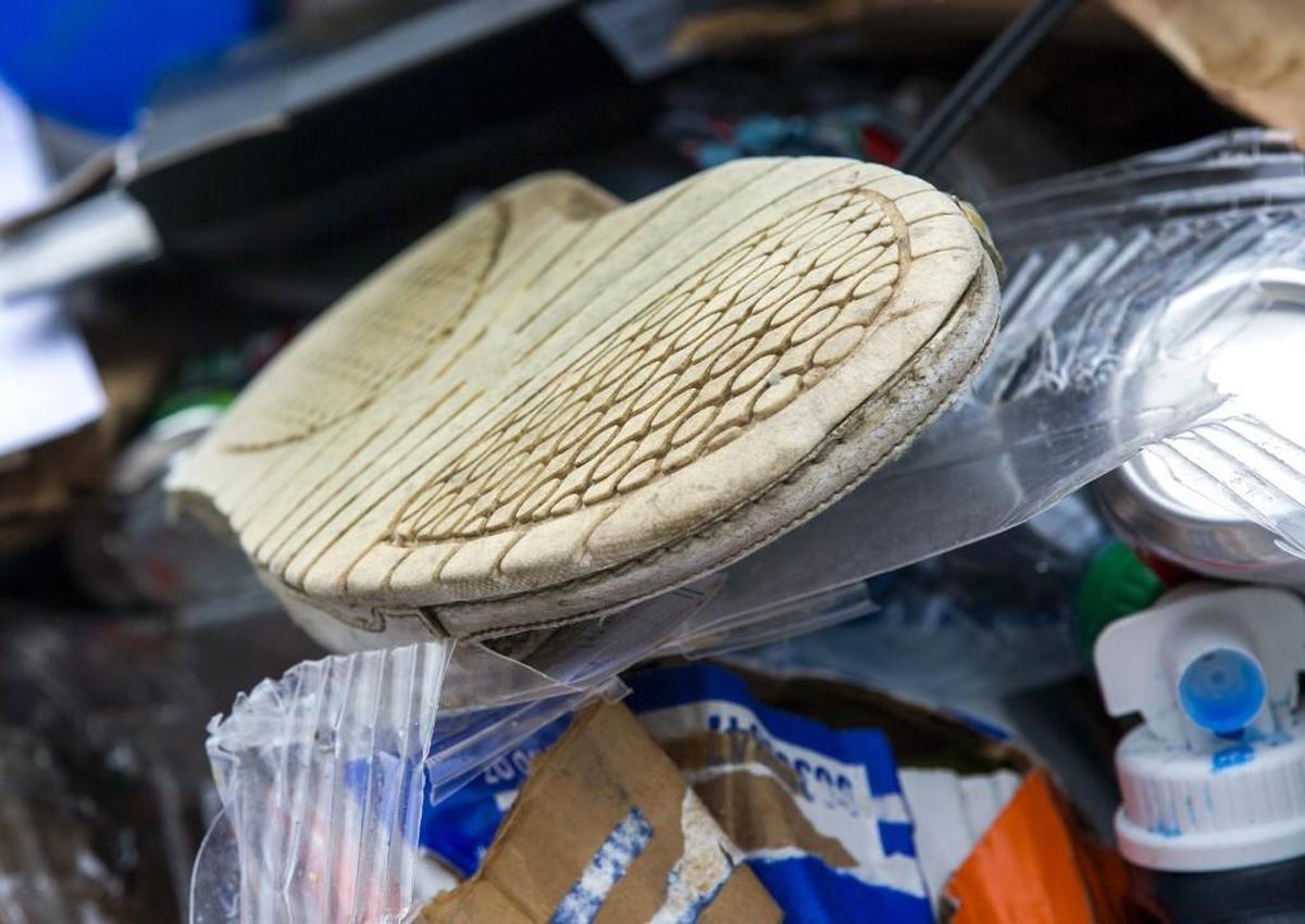 A freshly unloaded truck of recycling included a shoe which cannot be recycled.