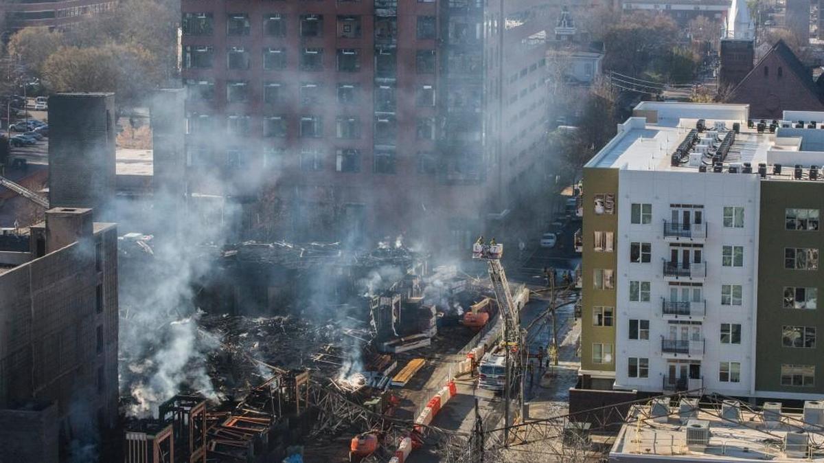 The March 7, 2017 fire destroyed the under-construction Metropolitan apartment building in the foreground, and damaged the Link Apartments, on the right, and the Quorum Center, in the rear.