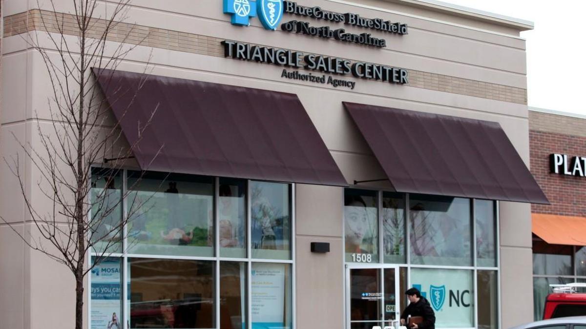 A client enters the Blue Cross Blue Shield of North Carolina Triangle Sales Center in the Village Market Place shopping center in Morrisville. The insurer is projecting a loss of more than $400 million on its Affordable Care Act business in North Carolina