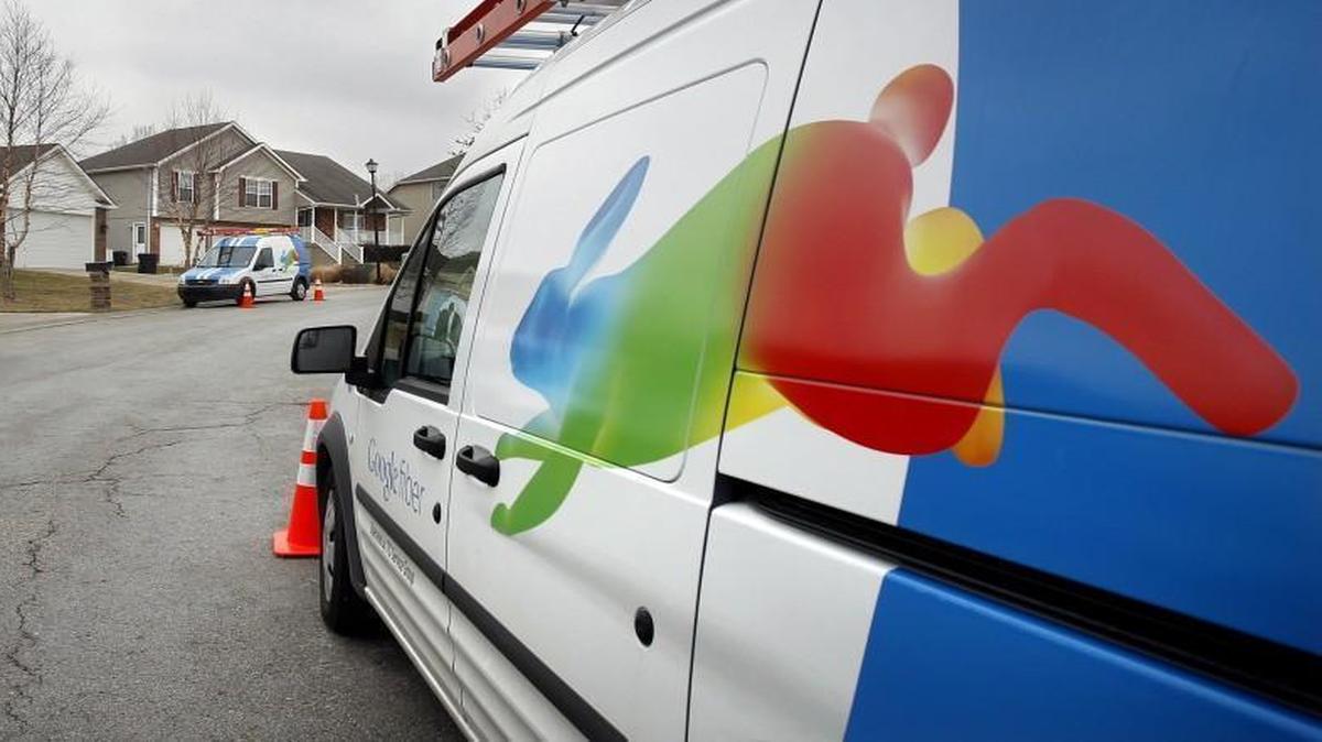Installers for Google Fiber work in Kansas City in 2013. After more than a year of crews digging up yards and eager customers wearing specially made “#FiberIsComing” T-shirts, Google Fiber has finally arrived in the Triangle.