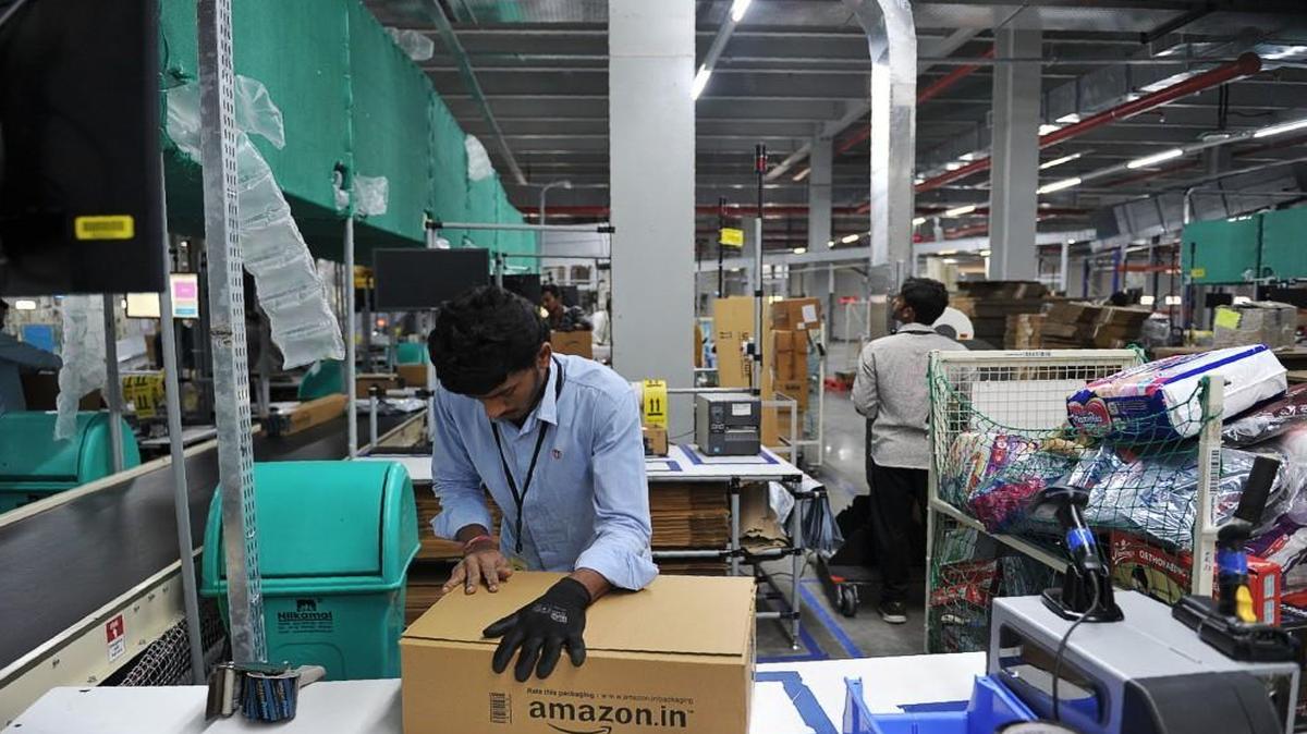 Indian employees work inside Amazon's largest Fulfillment Centre in India in September.