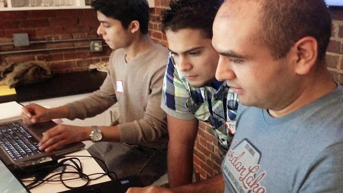 Ramiro Rodriguez, right, is the founder and lead teacher of Code the Dream.