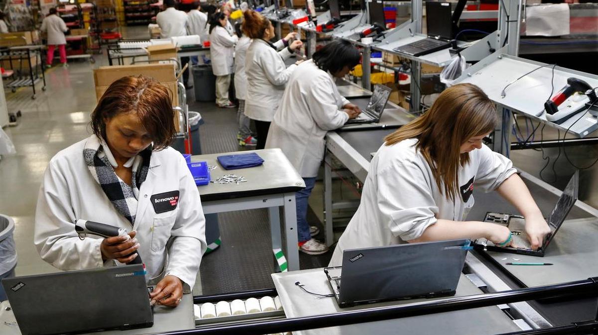 
Lenovo assemblers each install parts and do constant quality control checks as they pass along from station to station model 440 Think brand notebooks during a run of notebooks February 5, 2015 at the Whitsett ThinkCentre manufacturing facility in Whitsett, NC. The Lenovo production of Think products (desktop and notepad computers) began at the 300,000 square foot, two building facility in Guilford county, NC in 2013.
