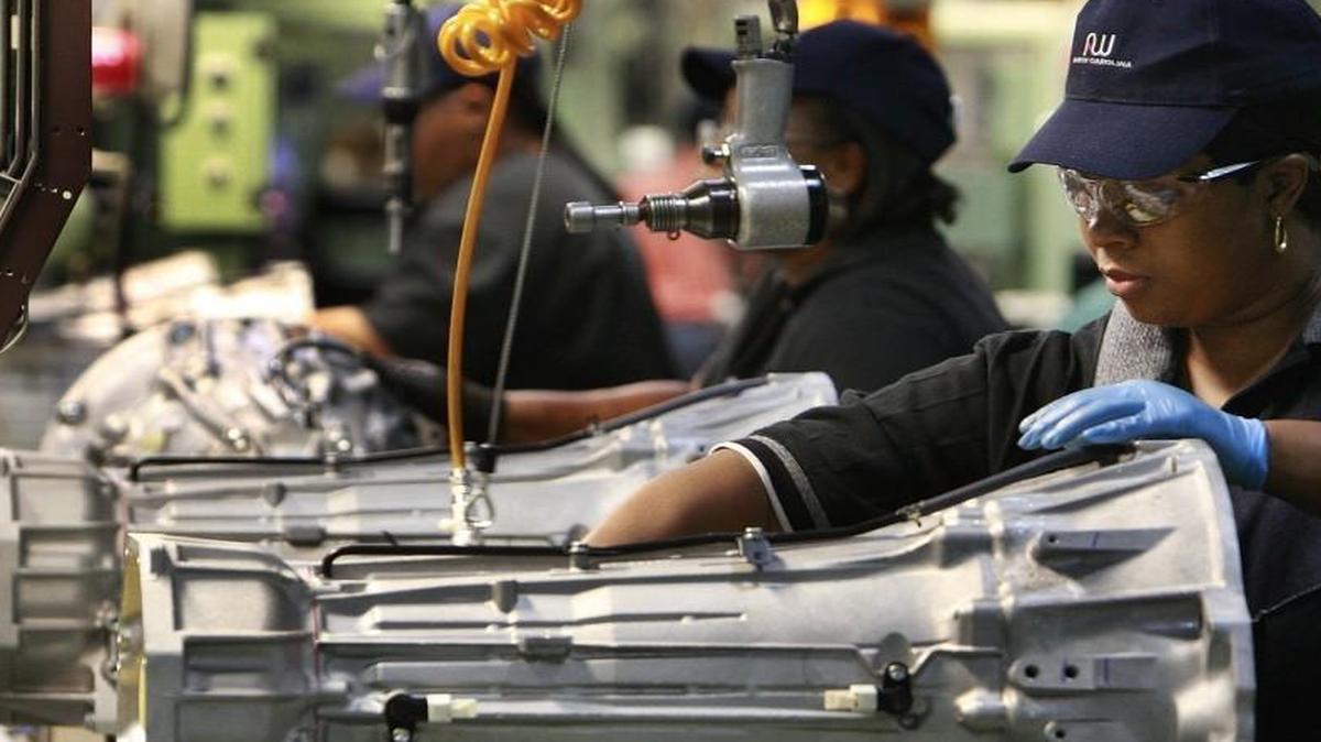 Frances Keene puts a neutral safety switch on a transmission at the AW North Carolina plant in Durham in 2008. The plant is one of many North Carolina operations that supply the auto industry with parts.