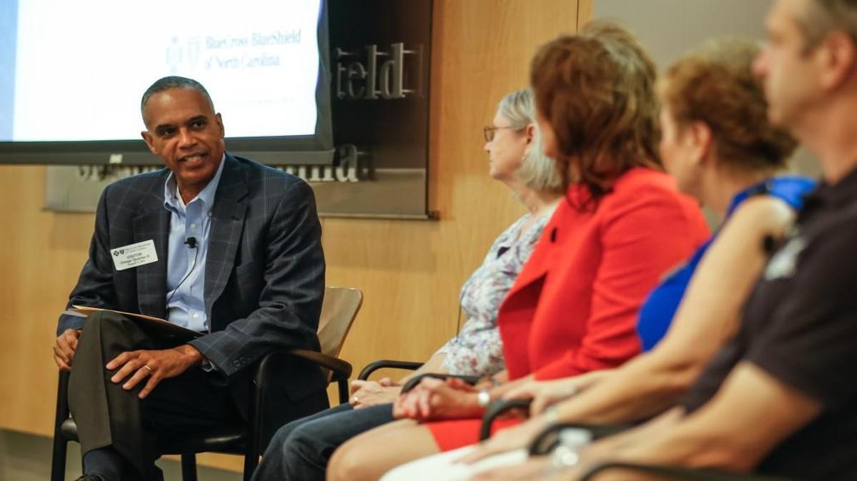 News & Observer publisher Orage Quarles III leads a panel of entrepreneurs during a ShopTalk breakfast focused on small business owners growing their business in Durham on August 5, 2014.