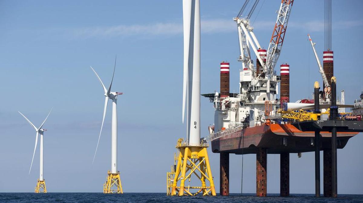 Duke Energy and TotalEnergies won the rights to develop two offshore wind areas off of southeastern North Carolina during an auction on Wednesday. This photo shows a $300 million, five-turbine wind farm developed by Deepwater Wind off of Block Island, R.I.