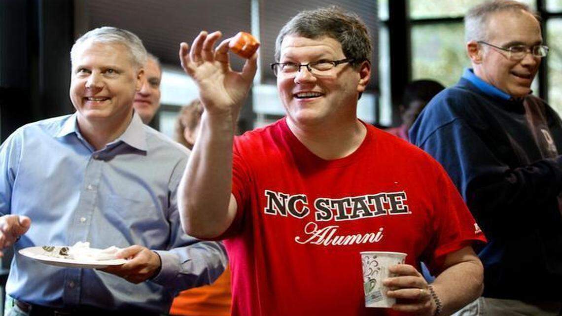 
Aviation Project Manager Ed Joyner, pulling for N.C. State, and about 130 employees at Kimley-Horn’s Cary office participate in a lunchtime gathering to celebrate March Madness on the first full day of play in the NCAA tournament.


