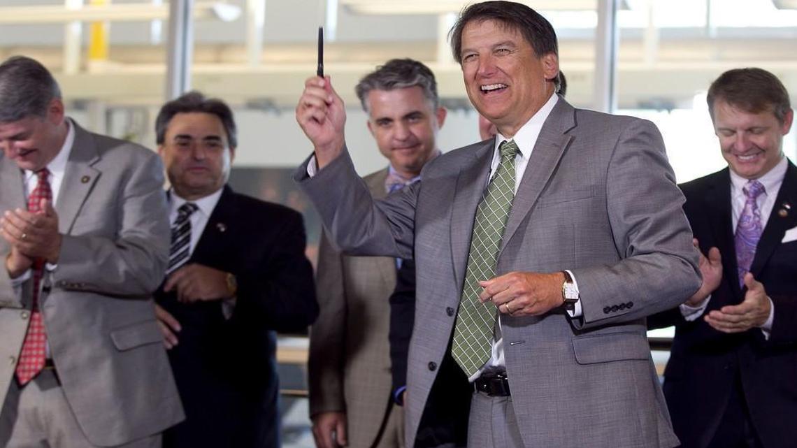 Governor Pat McCrory flanked by (l-r) Senator E.S. Newton, Senator Bob Rucho, Legislative staffer Jeff Warren, and Rep. Mike Hager applaud the governor following a bill signing to allow fracking in North Carolina at the N.C. State Department of Chemical and Biomolecular Engineering on the Centennial Campus in Raleigh, N.C. on Wednesday, June 4, 2014.