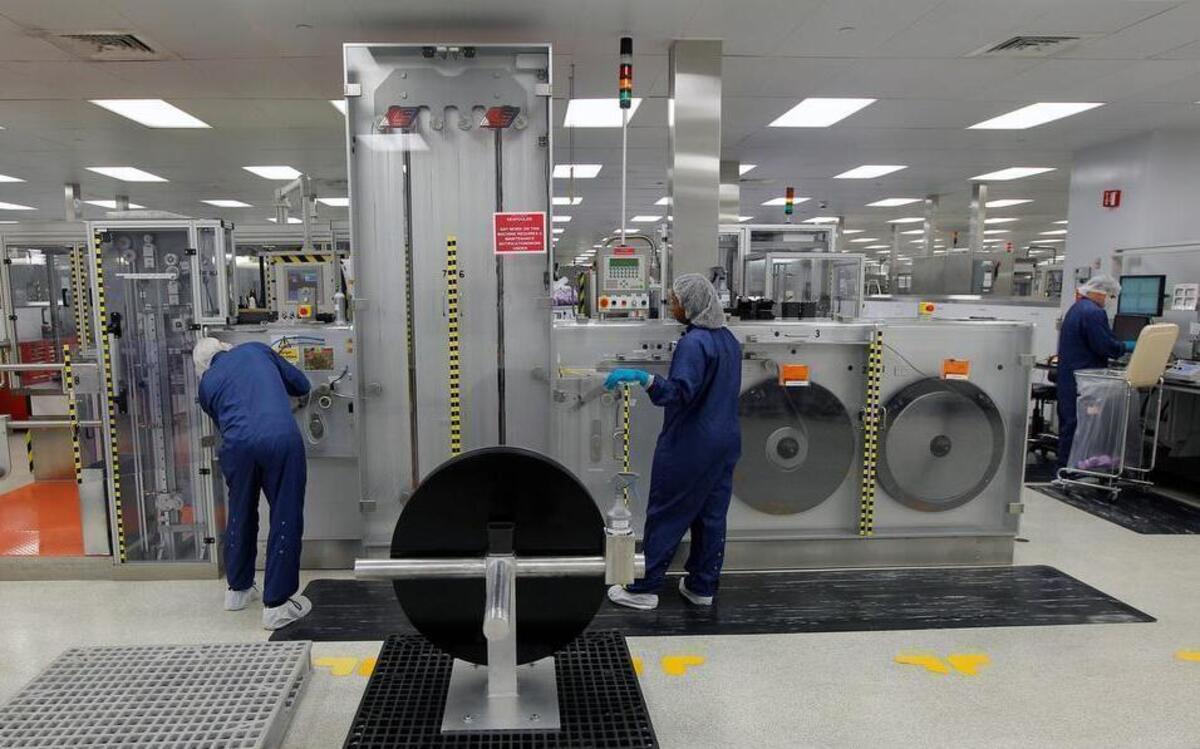 
Workers tend to one of the machines used to make Advair devices on the production line at GlaxoSmithKline's manufacturing facility in Zebulon on March 17, 2014. GSK said Tuesday, Aug. 11, 2015, it shut down its Zebulon site after the legionella bacteria was discovered in a cooling tower during routine testing.
