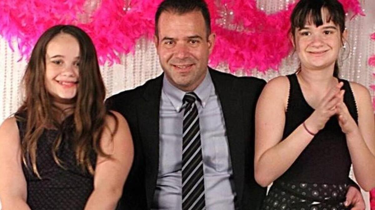 Mike Dempsey, 46, of Raleigh, and his two daughters. Dempsey survived Sept. 11, 2001 and the Las Vegas mass shooting.