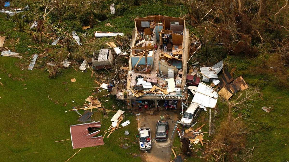 Just one example of the devastation caused by hurricane Maria, shown on Sept. 25, 2017. Nearly one week after hurricane Maria devastated the island of Puerto Rico, residents are still trying to get the basics of food, water, gas, and money from banks. Much of the damage done was to electrical wires, fallen trees, and flattened vegetation, in addition to home wooden roofs torn off.