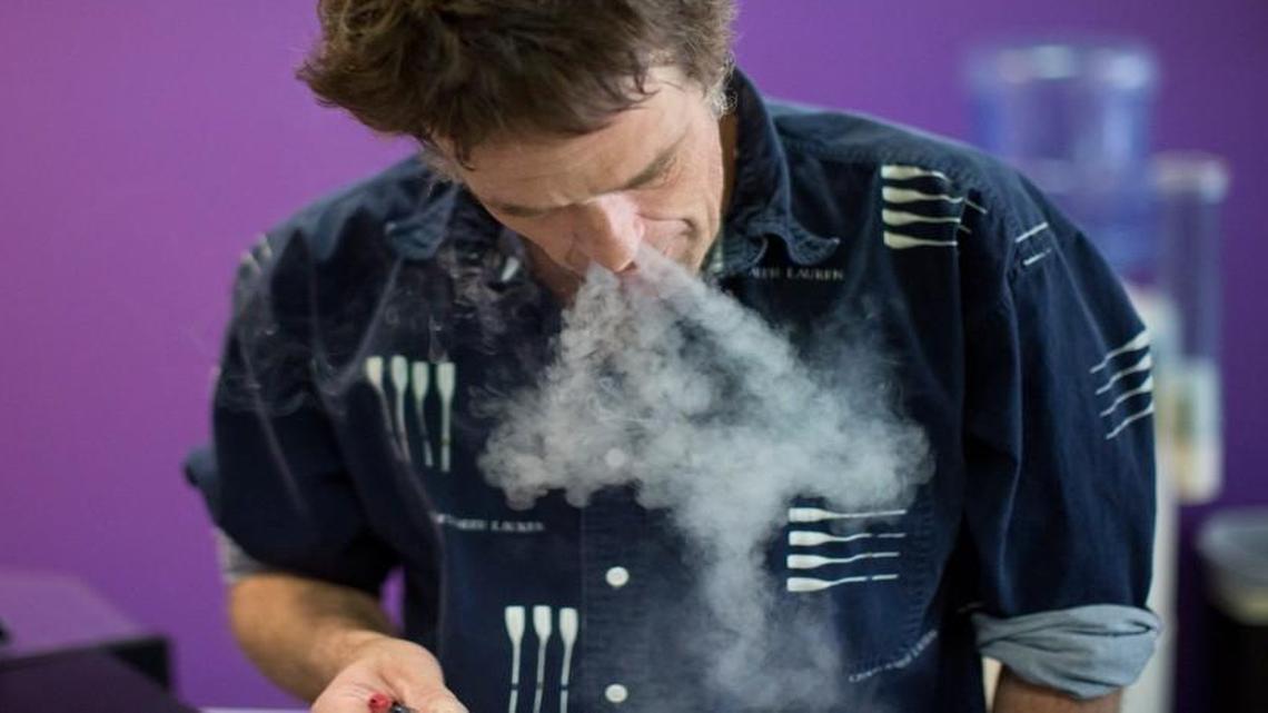 Robert Fassler tries out a new flavor in his electronic cigarette at E-Cigs in Cary, N.C. Fassler had surgery and switched from cigarettes to electronic cigarettes after his doctor’s recommended he do so to speed up the healing process.