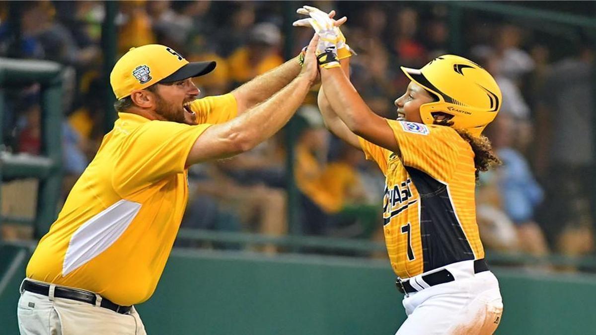 Greenville Little League coach Michael Vaughn, left, congratulates Ashton Byars after a two-run double against South Dakota in the Little League World Series tournament in South Williamsport, Pa.