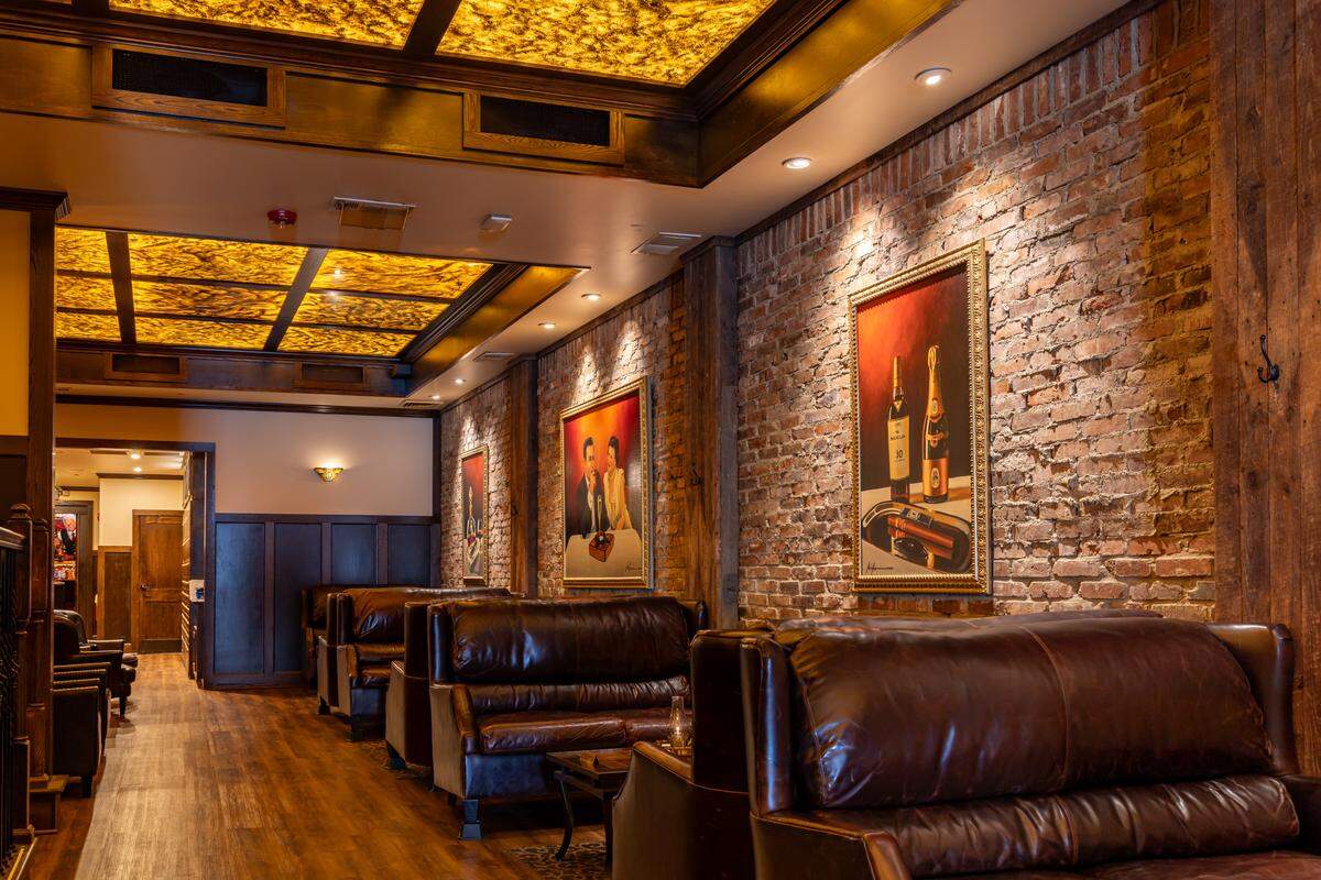 Durham’s new Red Phone Booth cocktail and cigar lounge will feature dark leather seating, fireplaces and a private room.
