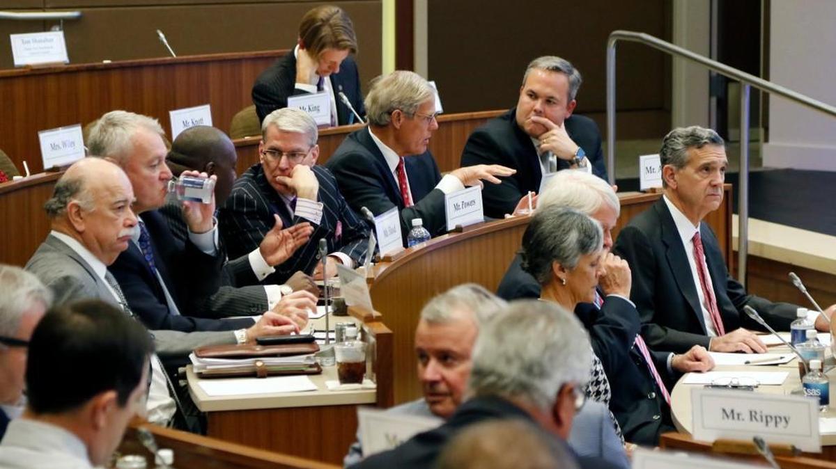 UNC Board of Governors members informally talk among themselves before the start of an emergency meeting of the UNC Board of Governors on the SAS campus in Cary Friday, October 16, 2015.