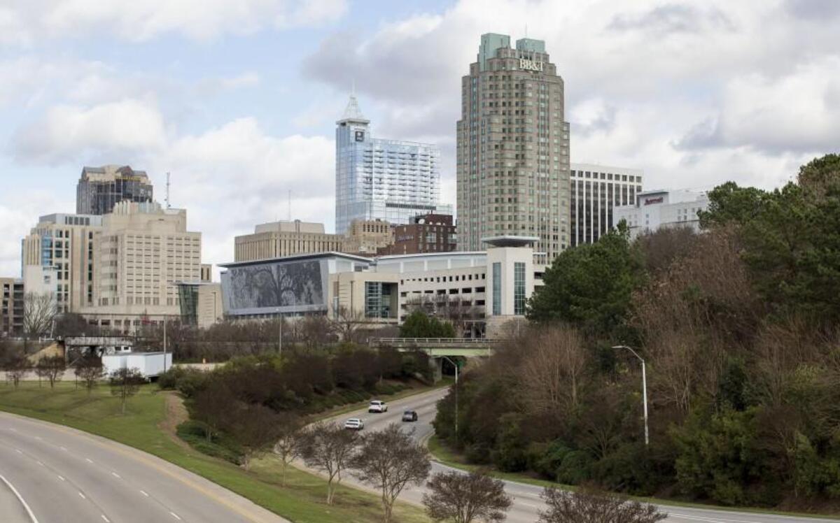 The downtown Raleigh skyline is seen from the Martin Luther King Jr. Blvd. overpass. A vision plan that the Raleigh City Council approved in September envisions a sports stadium south of the Raleigh Convention Center, roughly the foreground area of this photograph, among other major changes.