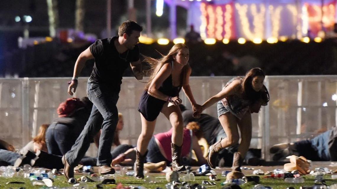 People run from the Route 91 Harvest country music festival after apparent gun fire was hear on October 1, 2017 in Las Vegas, Nevada. A gunman has opened fire on a music festival in Las Vegas, leaving more than 50 people dead and more than 500 injured. Police have confirmed that one suspect has been shot. The investigation is ongoing.