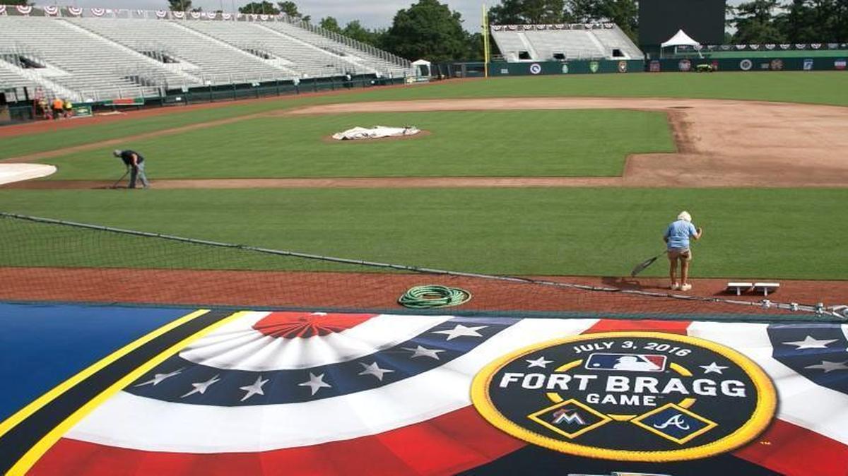 Chad Olsen, left, and Sharon Majeski work on the field as final preparations are made on Thursday, June 30, 2016, for the major league game between the Atlanta Braves and the Florida Marlins to be played on base at Ft. Bragg on Sunday, July 3.