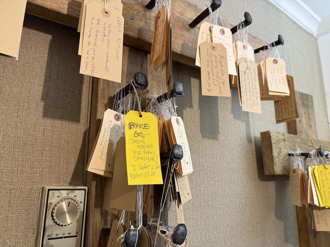 Inside The Perfect Piece in Cary, customers hang prayer requests on crosses. There’s also a notebook where customers can write how their prayers were answered.