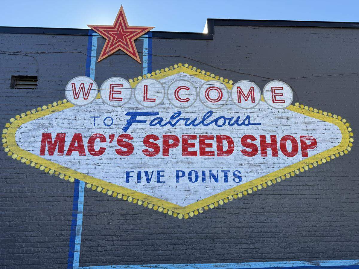 A mural by Erica Ashley of MYLK Murals decorates an exterior wall of Mac’s Speed Shop in Raleigh.