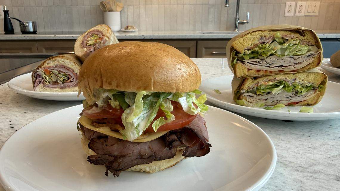A beef sandwich from Garlic Bay, center, is made with London broil, smoked Gouda, lettuce, tomato and horseradish sauce. It is one of five sandwich options available at the new restaurant.