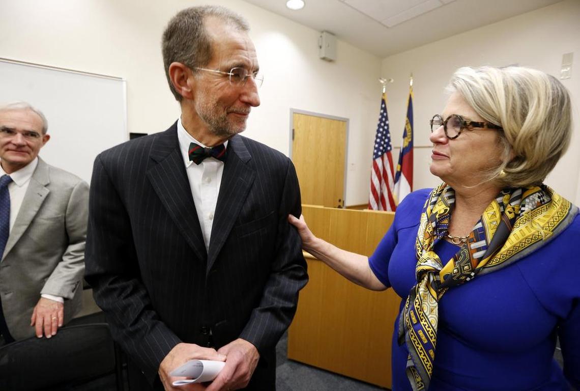 UNC President Margaret Spellings congratulates Dr. William Roper after he was named UNC system interim president at the UNC Board of Governors meeting at the UNC Center for School Leadership Development in Chapel Hill, N.C., Thursday, Nov. 1, 2018.