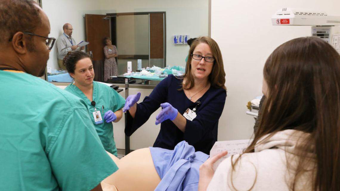Dr. Suzanne Dixon, center, is an obstetrician and gynecologist at Mountain Area Health Education Center.