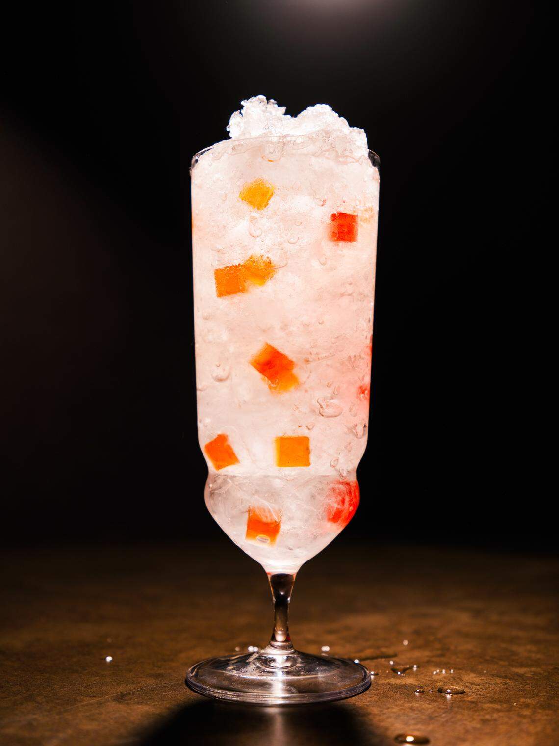 Capulet Cocktail Club’s version of the Quattro Bianchi is made with rum, gin, tequila, Cointreau and tart soda, served in a footed pilsner glass with pebble ice and gelatin cubes.
