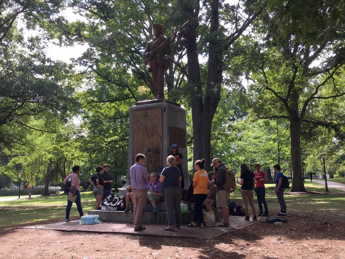 Authorities at UNC-Chapel Hill on Thursday took signs, benches, tables and other materials left around Silent Sam by the protesters who’ve called on the university to take the statue down.