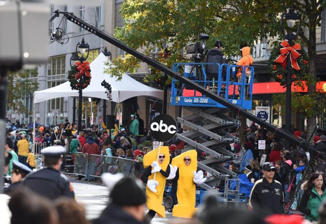 Promoting television channel ABC 11, two people dressed as the number 11 march past the channel’s studios in the Raleigh Christmas Parade in Raleigh, N.C. on Saturday, November 18, 2017.