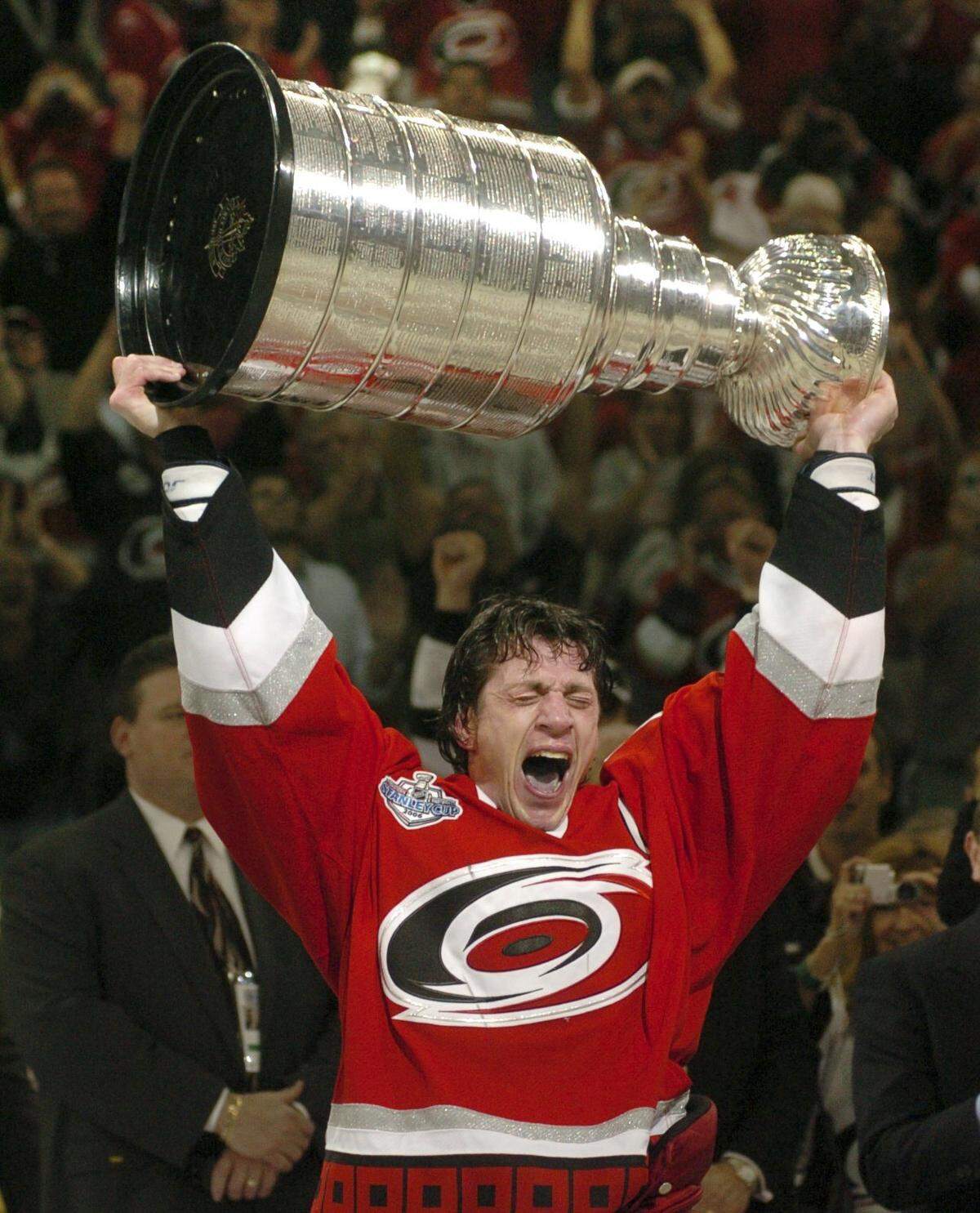 Then-Hurricanes captain Rod Brind'Amour, now coach of the team, accepts the Stanley Cup trophy in June 2006. Fans who attended one of the playoff games that year paid $7 for parking at what was then called the RBC Center.