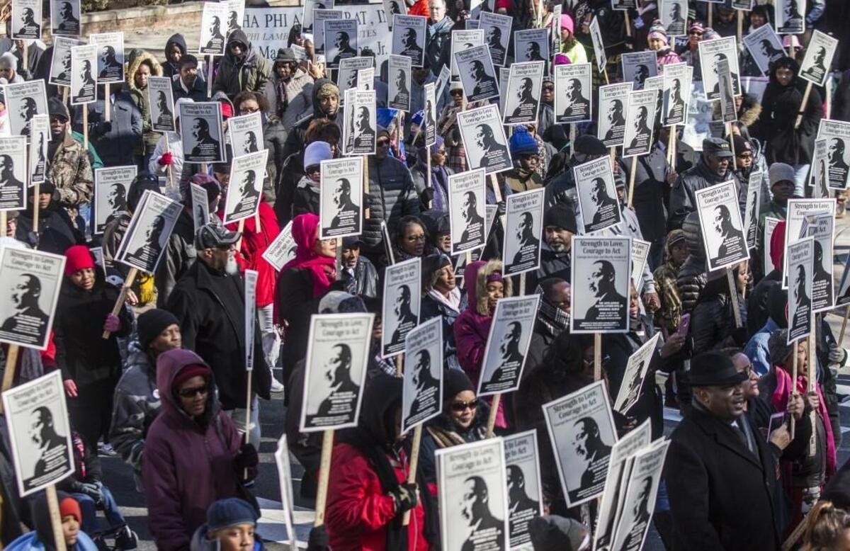 Hundreds march in honor of Dr. Martin Luther King Jr. Monday morning, Jan. 15, 2018 in downtown Raleigh during the annual MLK Memorial Day March.