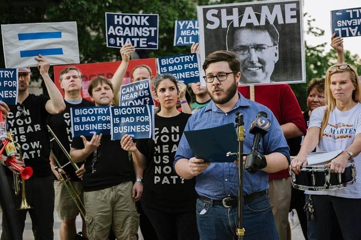 Logan Smith speaks at an Air Horn Orchestra rally against HB2 outside the state capitol in Raleigh in 2016.