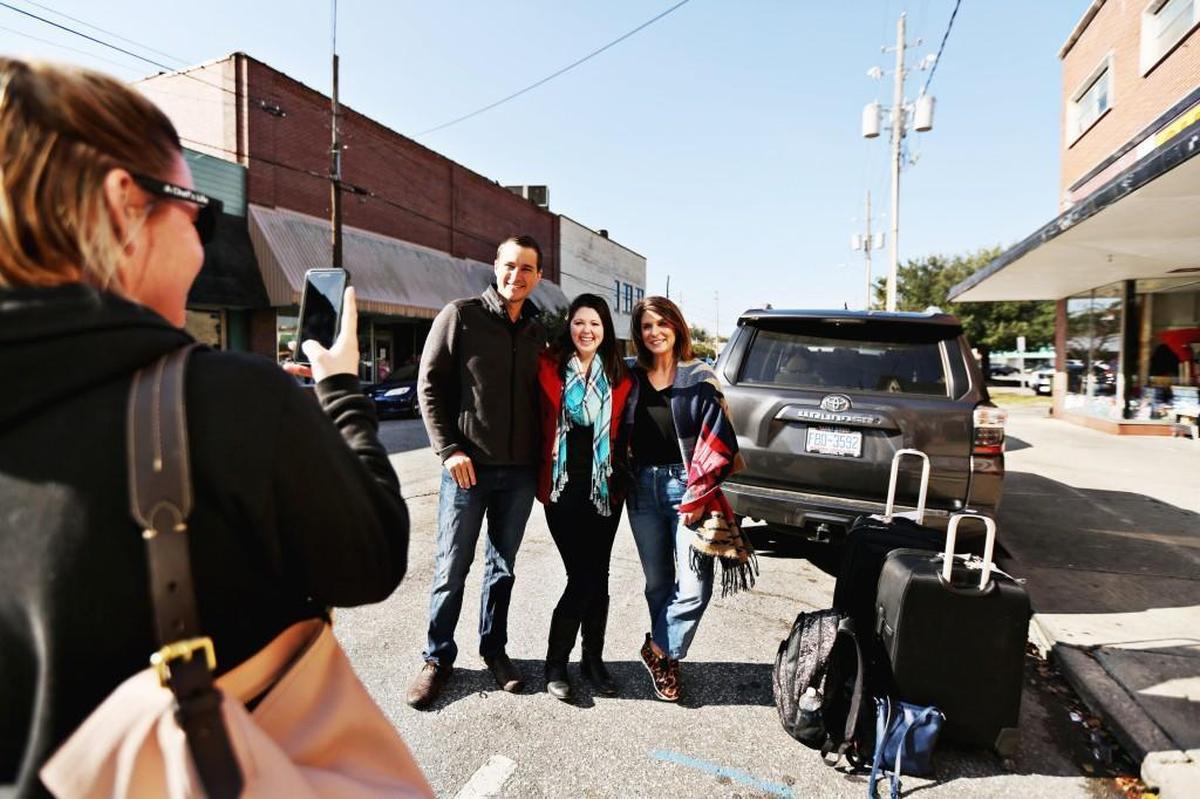 Zach Barba, second from left, and Amanda Barba, third from left, came to Kinston from Delaware to celebrate Amanda’s 30th birthday and eat at Chef & the Farmer. They spotted Vivian Howard, right, in downtown Kinston before leaving town and Howard’s assistant, Holley Pearce, took the couple’s photo with Howard.