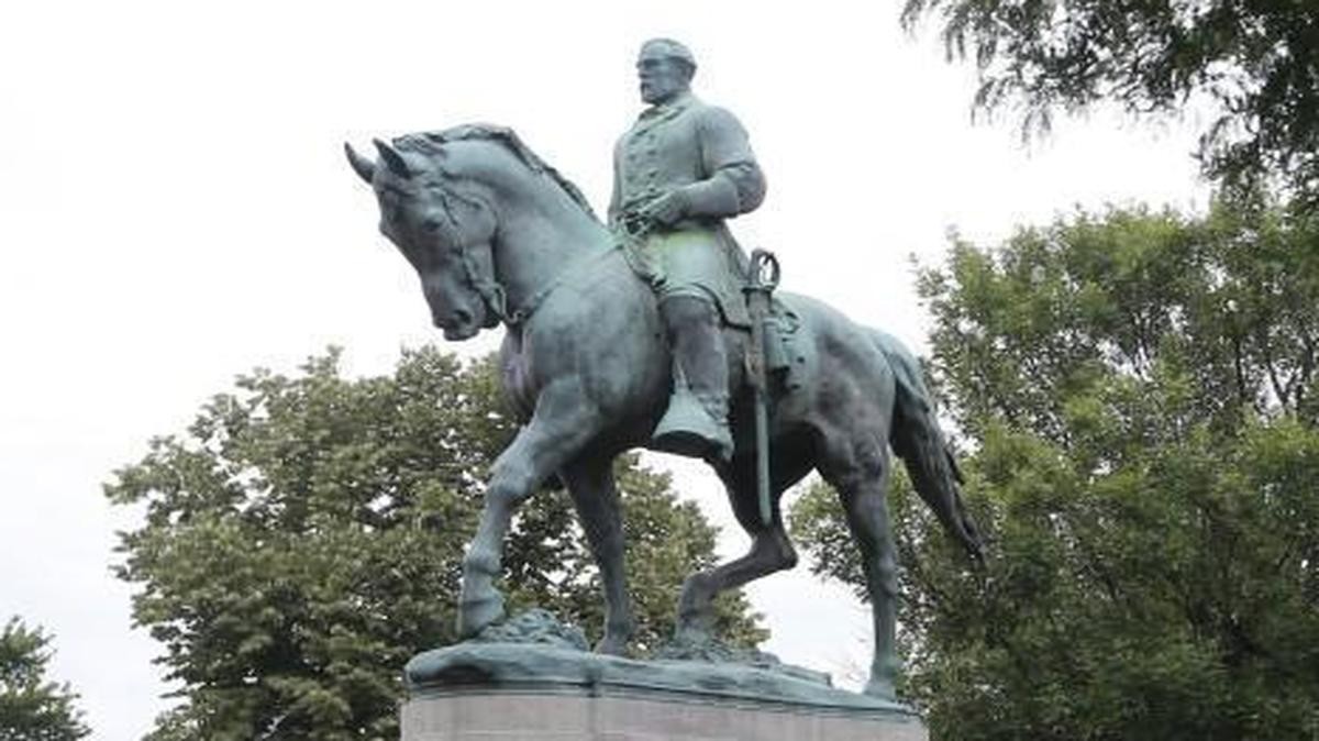 The statue of Confederate General Robert E. Lee still stands in Lee park in Charlottesville, Va., Monday, Aug. 14, 2017. The removal of the statue is in litigation and is at the center of the racial tensions and demonstrations in the town. (AP Photo/Steve Helber)