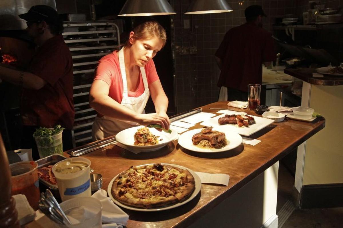 Vivian Howard works in the kitchen at Chef & the Farmer in 2012 in downtown Kinston.