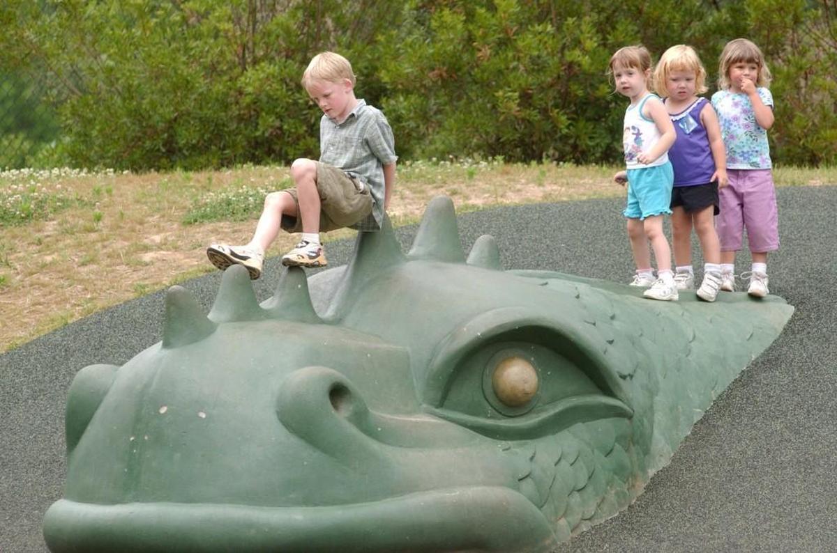Children play at the Kids Together Playground at Marla Dorrel Park in Cary.