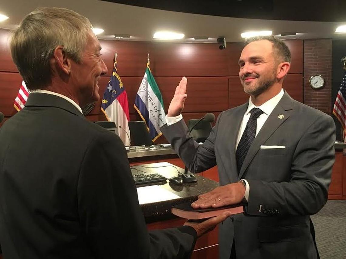 Cary Mayor Harold Weinbrecht, left, swears in Sean Stegall as Cary town manager in 2016.