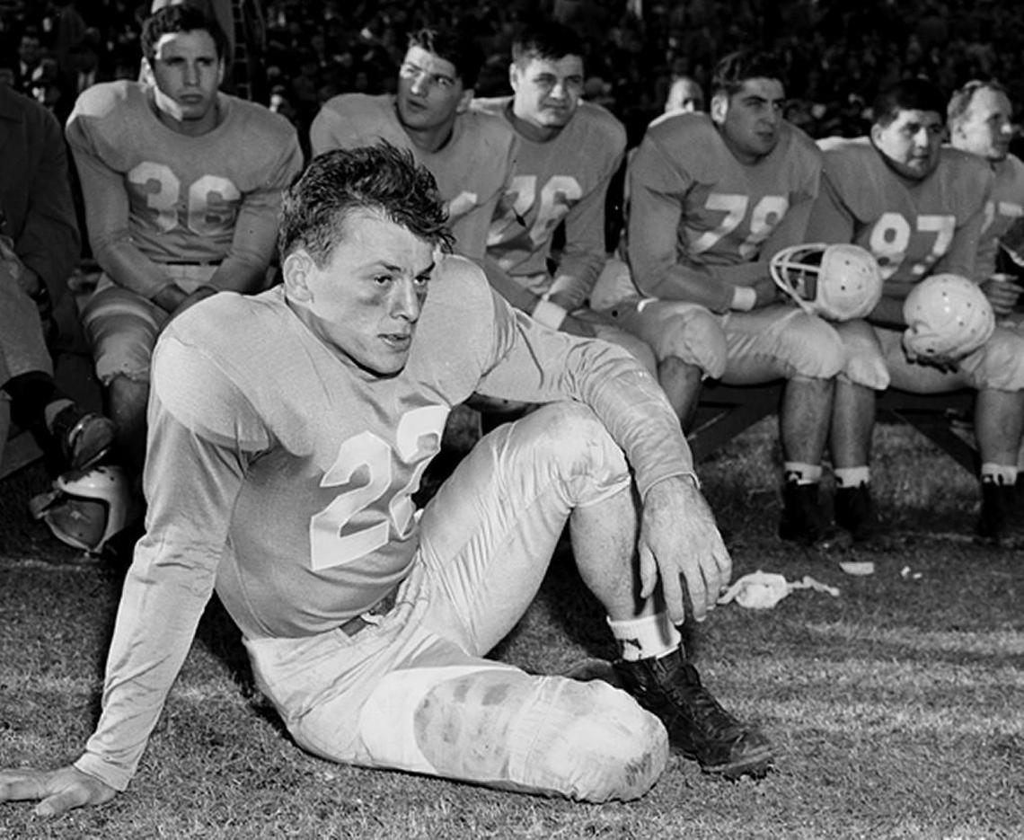 Charlie ‘Choo Choo’ Justice relaxed on the sideline during a UNC game in 1949.