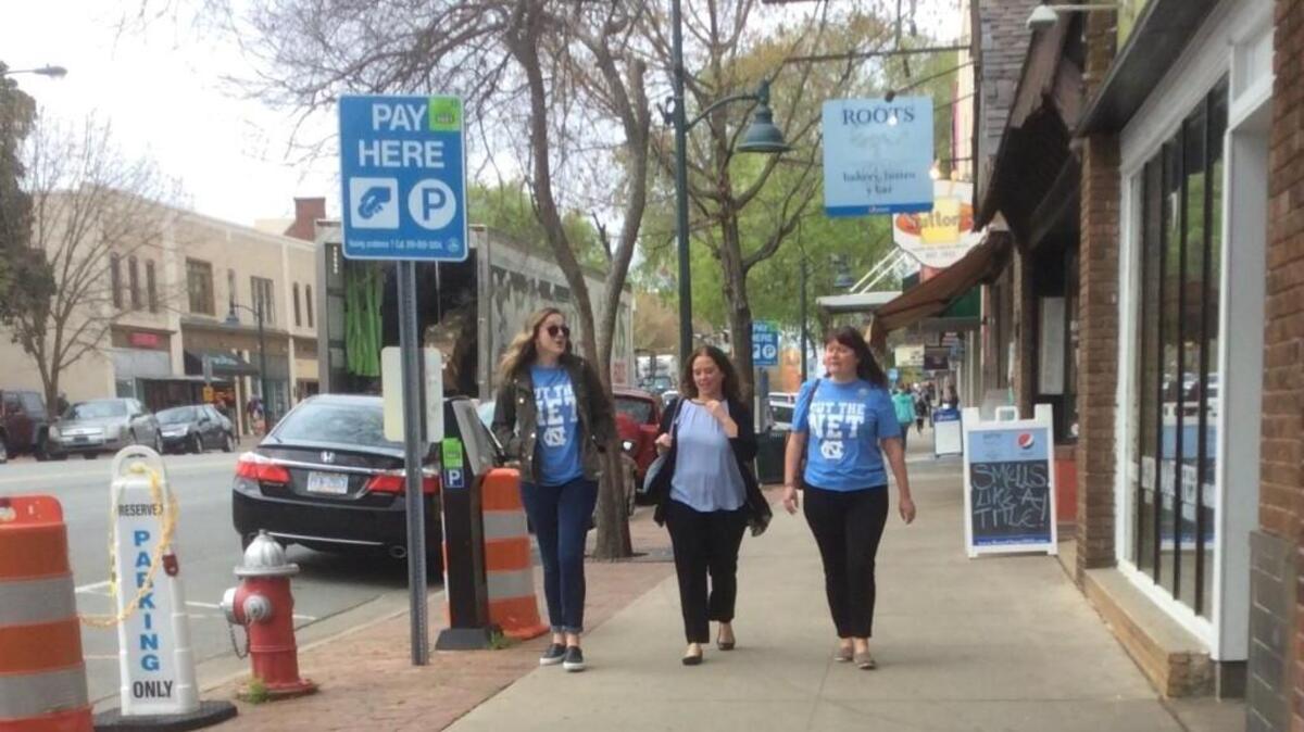 Tar Heel fans walk down Franklin Street in Chapel Hill on Monday, April 3, 2017.