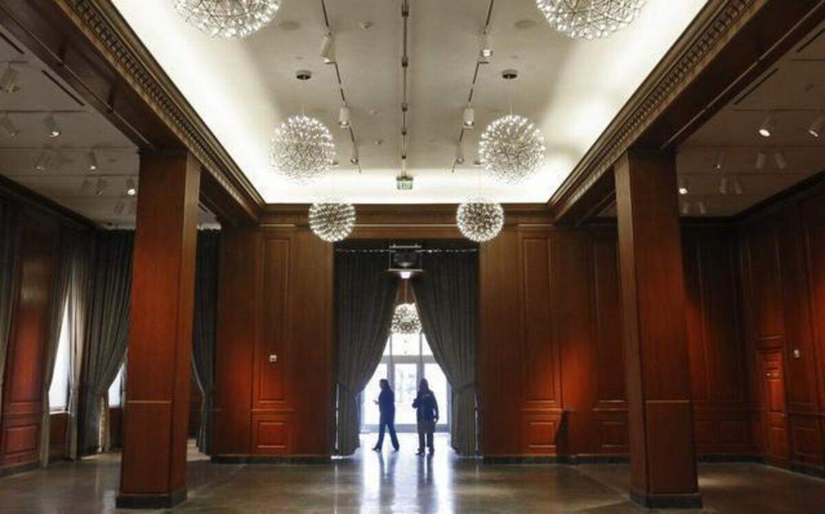 
Durham residents and art patrons walk through the first-floor main art gallery, formerly a corporate bank boardroom, Monday after the grand opening of the 21c Museum Hotel in the renovated Hill Building in downtown Durham.
