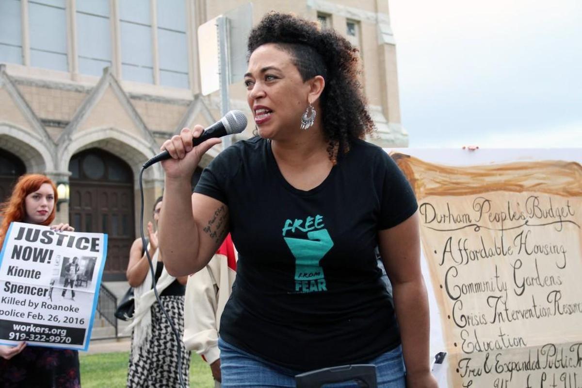 Serena Sebring leads a chant as about 175 people rally Monday, March 14, 2016, against a new $81 million Durham police headquarters planned for East Main Street downtown. The crowd blocked traffic outside the existing station on West Chapel Hill Street for about 90 minutes while police watched. There were no arrests.