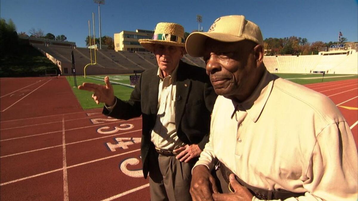 Legendary Olympic coaches Al Buehler, left, and the late LeRoy Walker reminisced in September 2010 during filming of the documentary “Starting at the Finish Line: The Coach Buehler Story.” The film will be shown at 6 p.m. Monday, Aug. 22, at the Durham Main Library. Buehler, a three-time Olympic track and field coach, will attend.