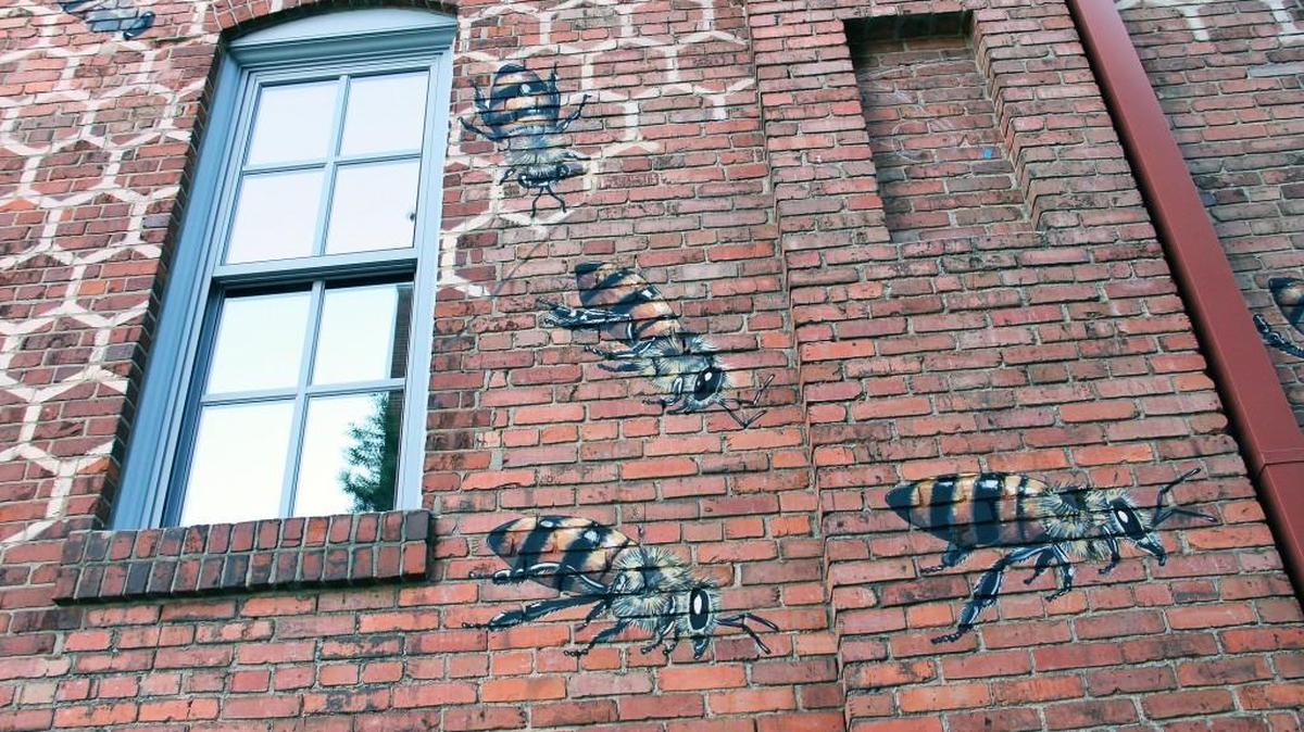 Painted bees fly outside the Burt’s Bee’s headquarters at the American Tobacco Campus in Durham. Clorox, which owns Burt’s Bees, has established its own offices around the campus.