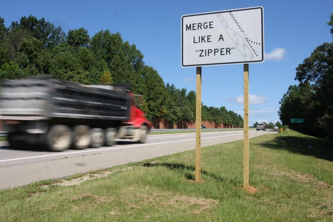 New signs on N.C. 147 encourage people to “merge like a zipper,” as they approach Interstate 85 South. The N.C. Department of Transportation is using the signs as an experiment in the hopes of reducing congestion in areas where motorists merge.