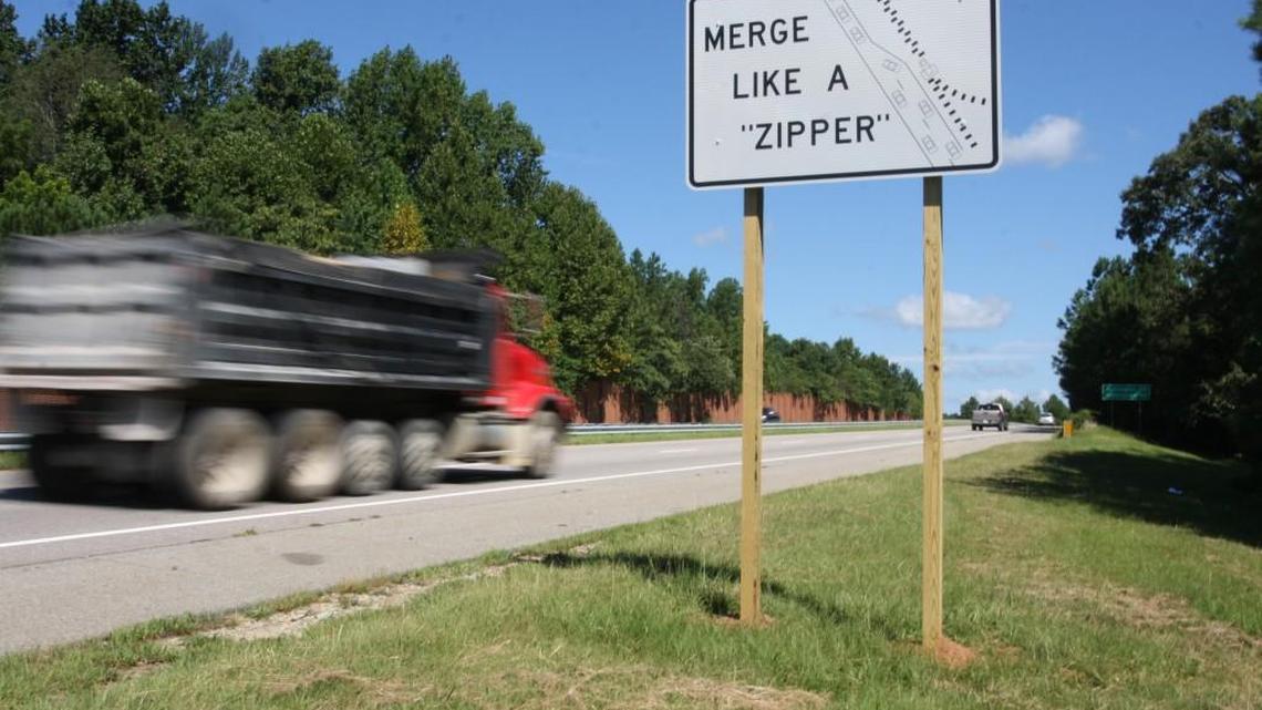 New signs on N.C. 147 encourage people to “merge like a zipper,” as they approach Interstate 85 South. The N.C. Department of Transportation is using the signs as an experiment in the hopes of reducing congestion in areas where motorists merge.