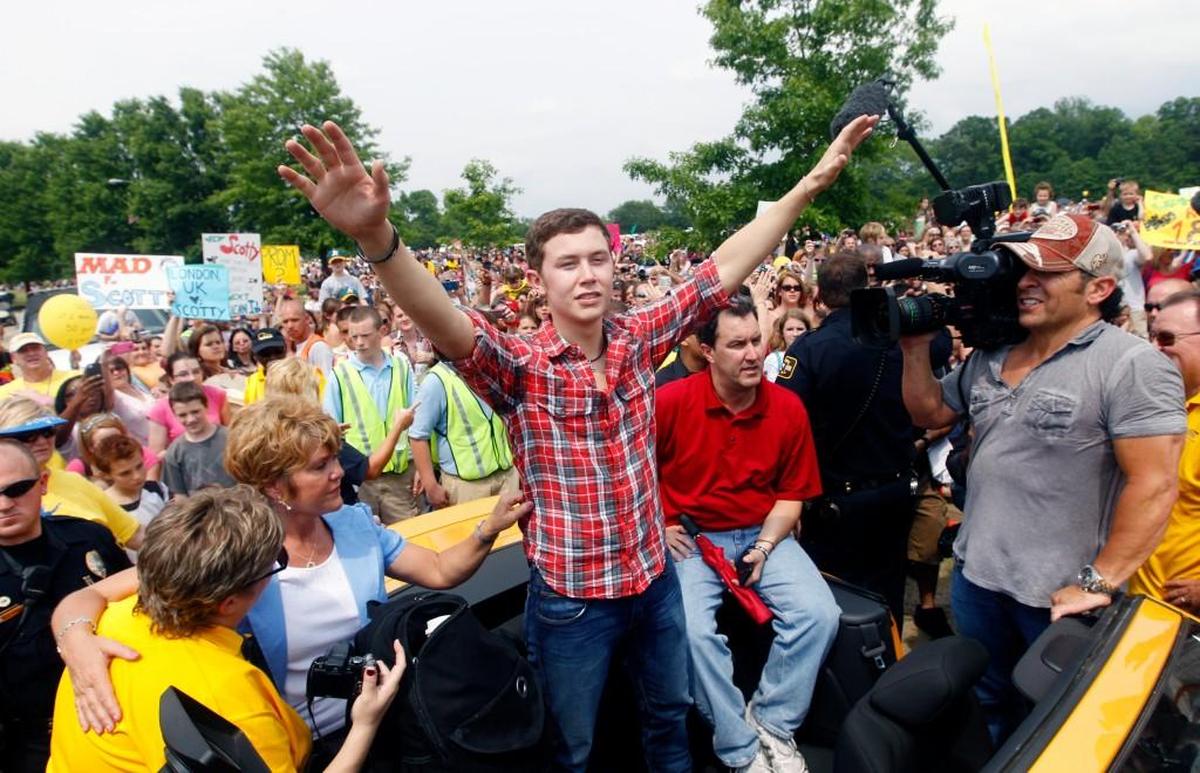 “American Idol” winner Scotty McCreery acknowledges the crowd during his parade before his concert Saturday May 14, 2011, at Lake Benson Park in Garner, N.C. McCreery’s hometown visit and North Carolina’s connections with “American Idol” is featured in the book “Step It Up and Go: The Story of North Carolina Popular Music, from Blind Boy Fuller and Doc Watson to Nina Simone and Superchunk,” by David Menconi.